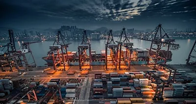 Container vessel being loaded at a port terminal
